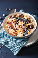 healthy banana smoothie bowl with blueberry chocolate walnuts