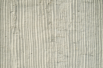 Fototapeta premium Old ecru plaster on wall closeup