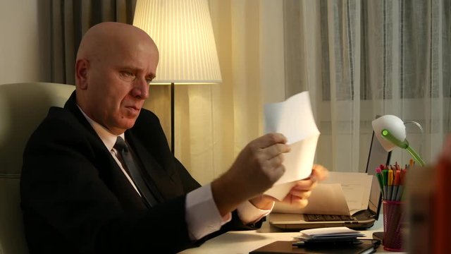 Businessperson Make Accounting Calculations Reading Invoices Payments and Debts