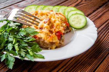 Pork chop with cheese and red pepper 