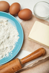 Ingredients recipe bakery products on a white table. View from above.