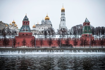 Moscow, Russia - March 28, 2018: A nice view of the Moscow Kremlin and Russian Orthodox churches from the embankment, snow covers the ground