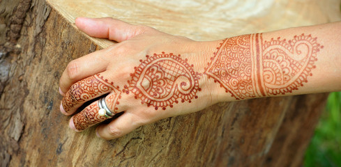 Tattooed hand, tattoo, nature. Woman