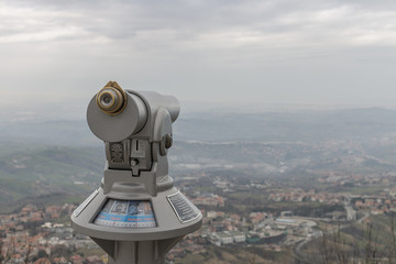 San Marino - March 1, 2018: Tourist binocular telescope for San Marino city observation 