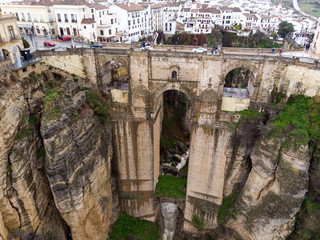 New bridge in Ronda, one of the famous white villages in Andalucia, Spain. Photo from air, March 2018