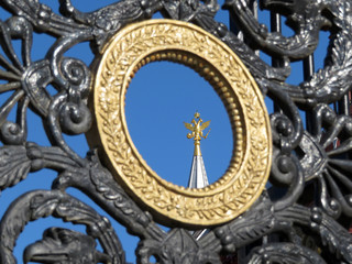 View of the Russian double-headed eagle through the gates of the Alexander garden in Moscow. Russian landmarks