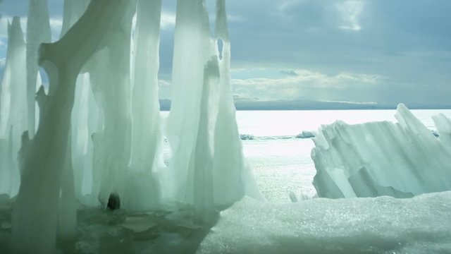 Icebergs on iced sea or ocean.