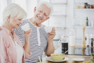 Senior marriage drinking coffee