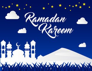 beautiful ramadan kareem background with paper art style on blue background