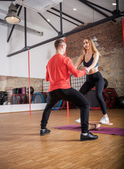 Fototapeta na wymiar Couple working out at fitness gym, balance exercise