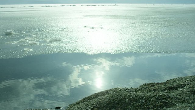 Beach of iced sea or ocean .