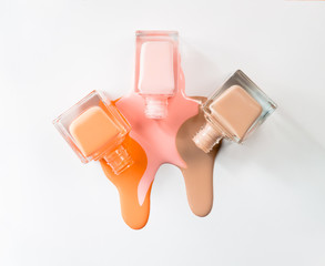 3 color nail Polish isolated on white background