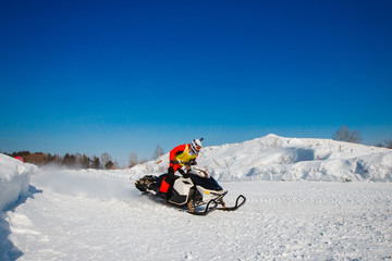 Snowmobile. Snowmobile races in snow. Concept winter sports, racers.