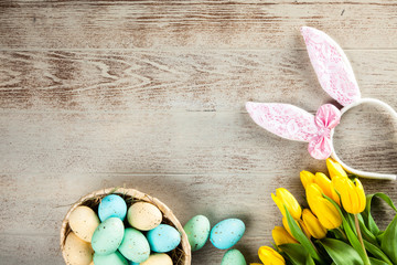 Yellow tulips on wooden background