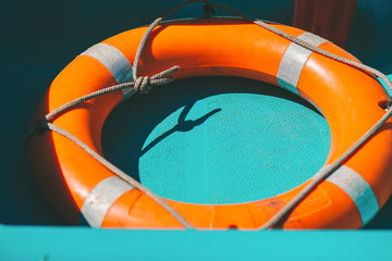 Circle rescue in the boat. Orange lifebuoy
