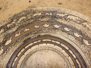 The artistic ancient moonstone in Anuradhapura ancient city which was placed at the bottom of staircases and entrances of the temple.