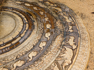 The artistic ancient moonstone in Anuradhapura ancient city which was placed at the bottom of staircases and entrances of the temple.