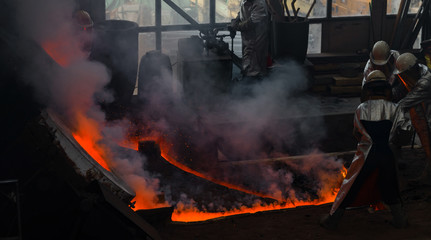 Classic technology of bell producing with melting steel to the ground. Casting new bell for Ebersmunster church in Alsace.