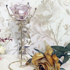 Beautiful flowers. Roses and an old candlestick on a beautiful background.