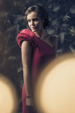 Portrait of a model wearing a party dress with lightbulbs