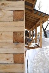 construction of the wooden house from a bar square dry after winter