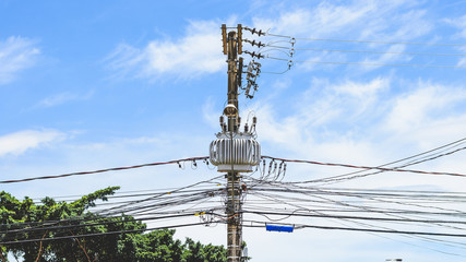 Power transformer on a pole. Light pole with energy distribution on a neighborhood from Brazil.