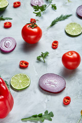 Seamless pattern with red pepper, onion, tomatoes, lime, dill on white background, top view, close-up, selective focus