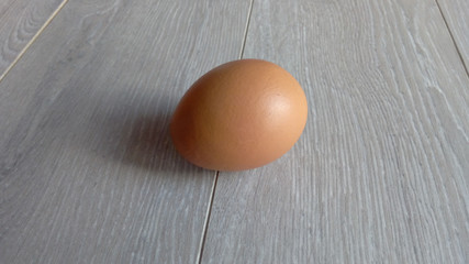 Egg chicken on a table or on a laminate  soft lighting