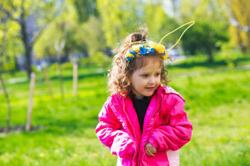 Kids in bunny ears and rabbit costume. Toddler kid play outdoor.