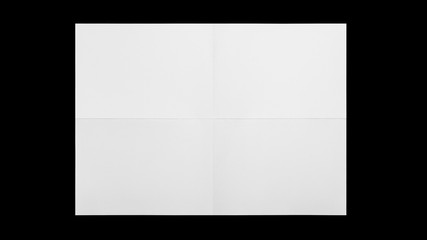 white sheet of paper folded isolated on black background
