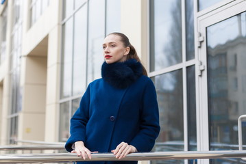 Woman, blue fur coat, street