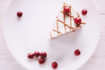 Chocolate cake with mousse, decorated cherries