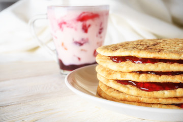 pancakes with jam and glass of smoothies