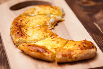 khachapuri (ghvezeli) in a half moon form for christmas day, Georgia
