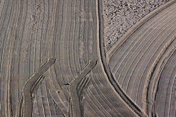 Cleaned by a tractor and people trampled sand on the Mediterrane