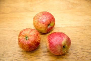 red apples on wooden  background 