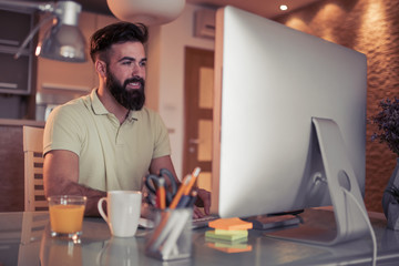 Young man running small business from home office