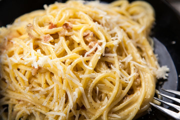 Spaghetti carbonara with egg and pancetta