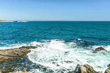 Rocks formation in the blue sea looks like a face in Sozopol, Bulgaria.