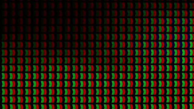 Macro view. Pixels changing colour on a high definition LED TVset screen.