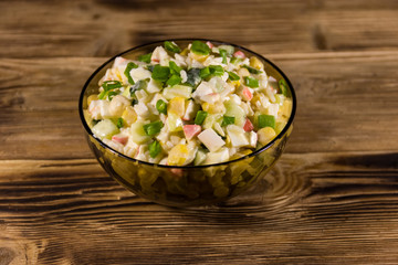 Salad with crab sticks, sweet corn, cucumber, eggs, rice and mayonnaise