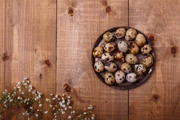 Eggs on plate on wooden table. Top view, text space