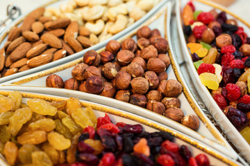bowl with mixed nuts and dried fruits such as raisins, almonds, hazelnuts and cashews.  Healthy food and snack
