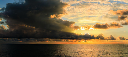 Fototapeta na wymiar Dramatic sky during a hurricane and sunset over the ocean