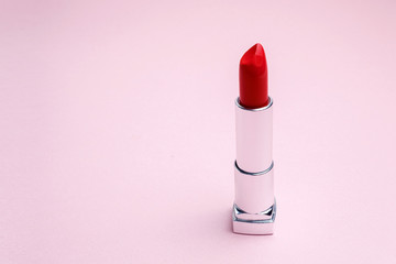 Red lipstick on pink background