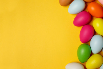 Colorful Easter eggs on a yellow background