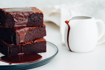 Chocolate brownie with chocolate syrup. American dessert. 