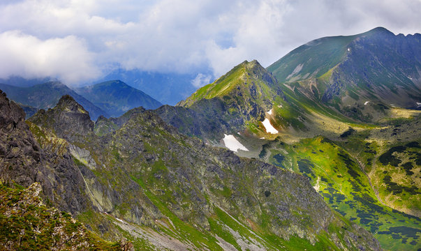 Poland, Tatra Mountains, Zakopane - Dolina Pieciu Stawow Valley, Zadni Staw Pond, Kotelnica, Gladki, Walentkowy peaks, Gladka and Walentkowa Pass with High Tatra mountain range panorama in background