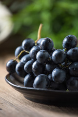 Dark grape in bowl.