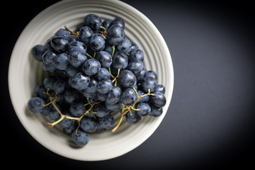 Dark grape in bowl.